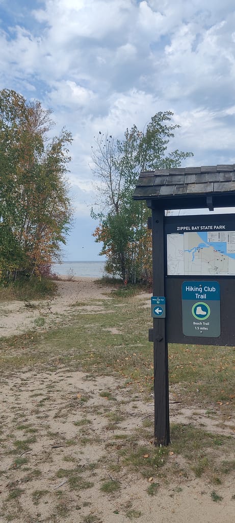 Sign at the Zippel Bay Costal Path trailhead in Zippel Bay State Park