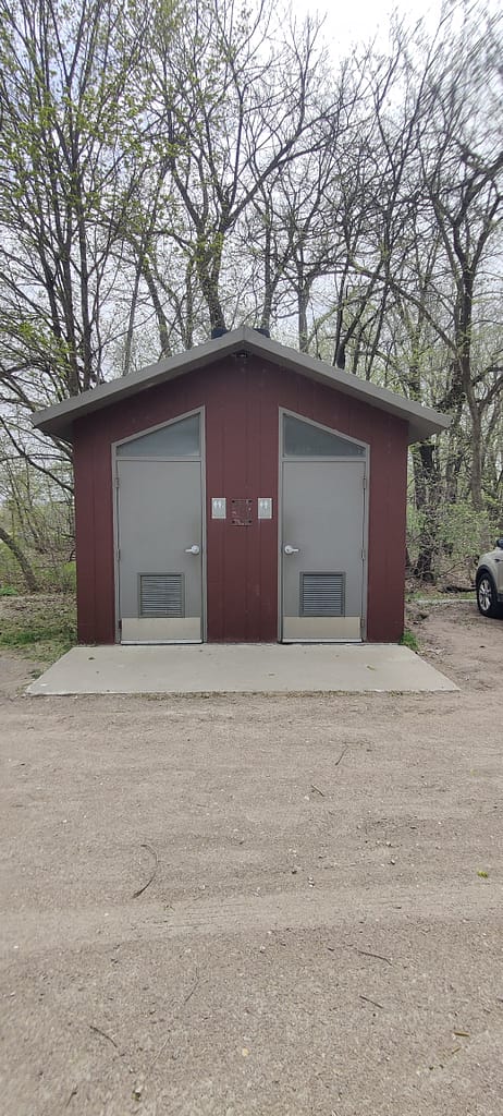 Vault toilets in the parking lot near the cabins at Maplewood State Park in Pelican Rapids, MN