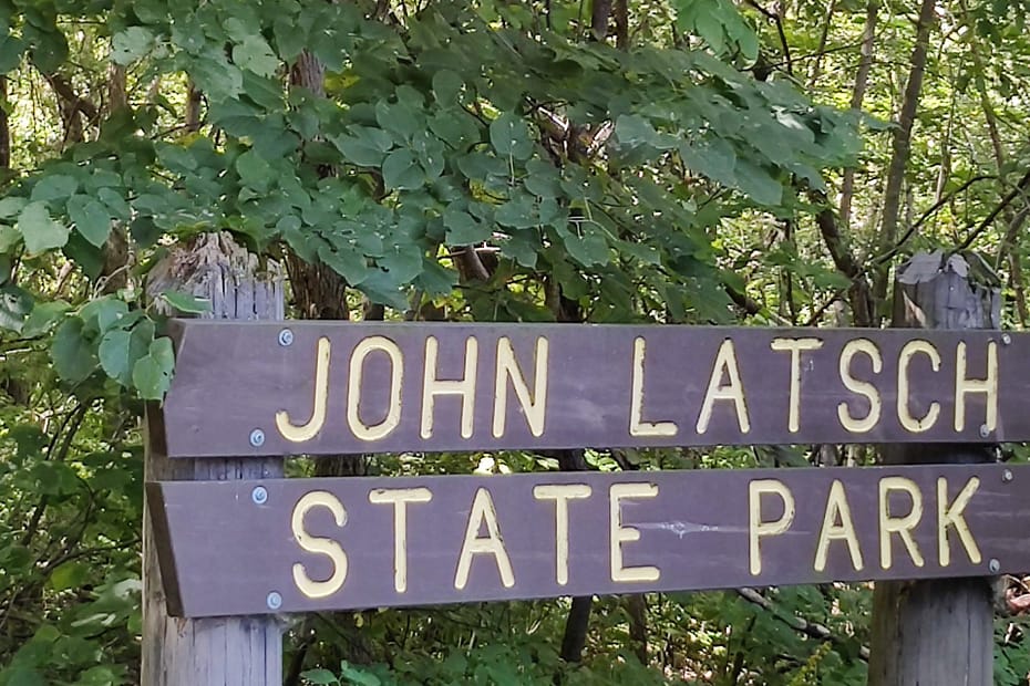Brown sign with yellow lettering that read John Latsch State Park